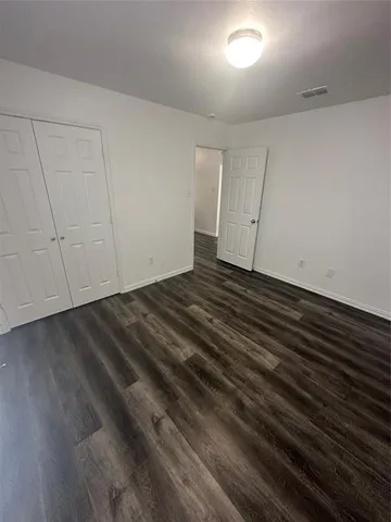 a view of room with hardwood floor