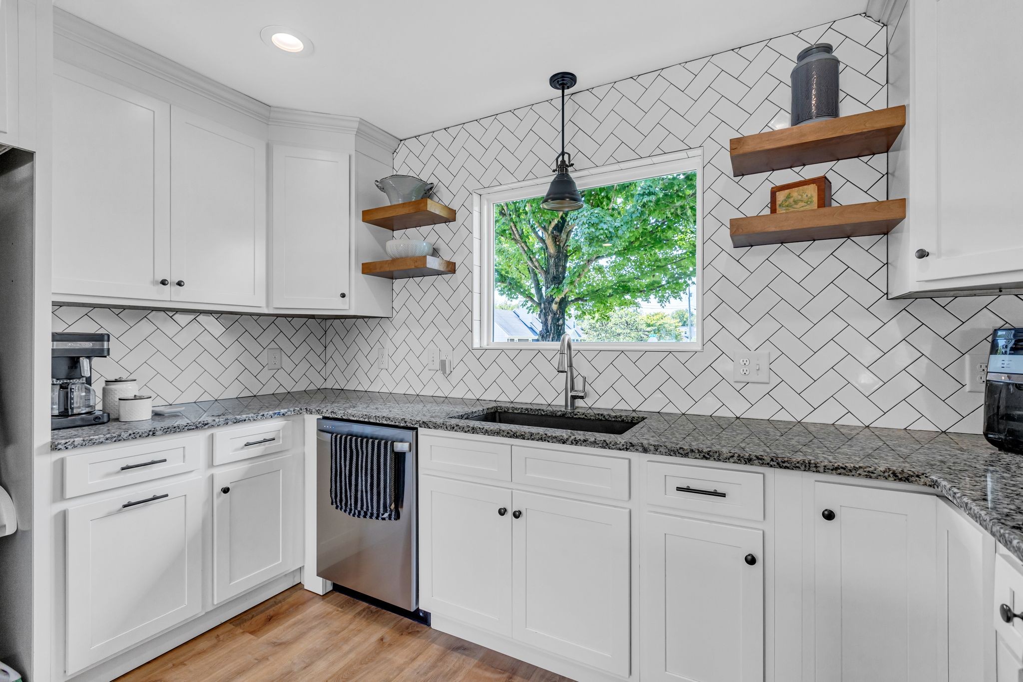 2808 Windy Way Thompson's Station, TN 37179 - Photo 11 of 39 a kitchen with stainless steel appliances granite countertop white cabinets and a stove