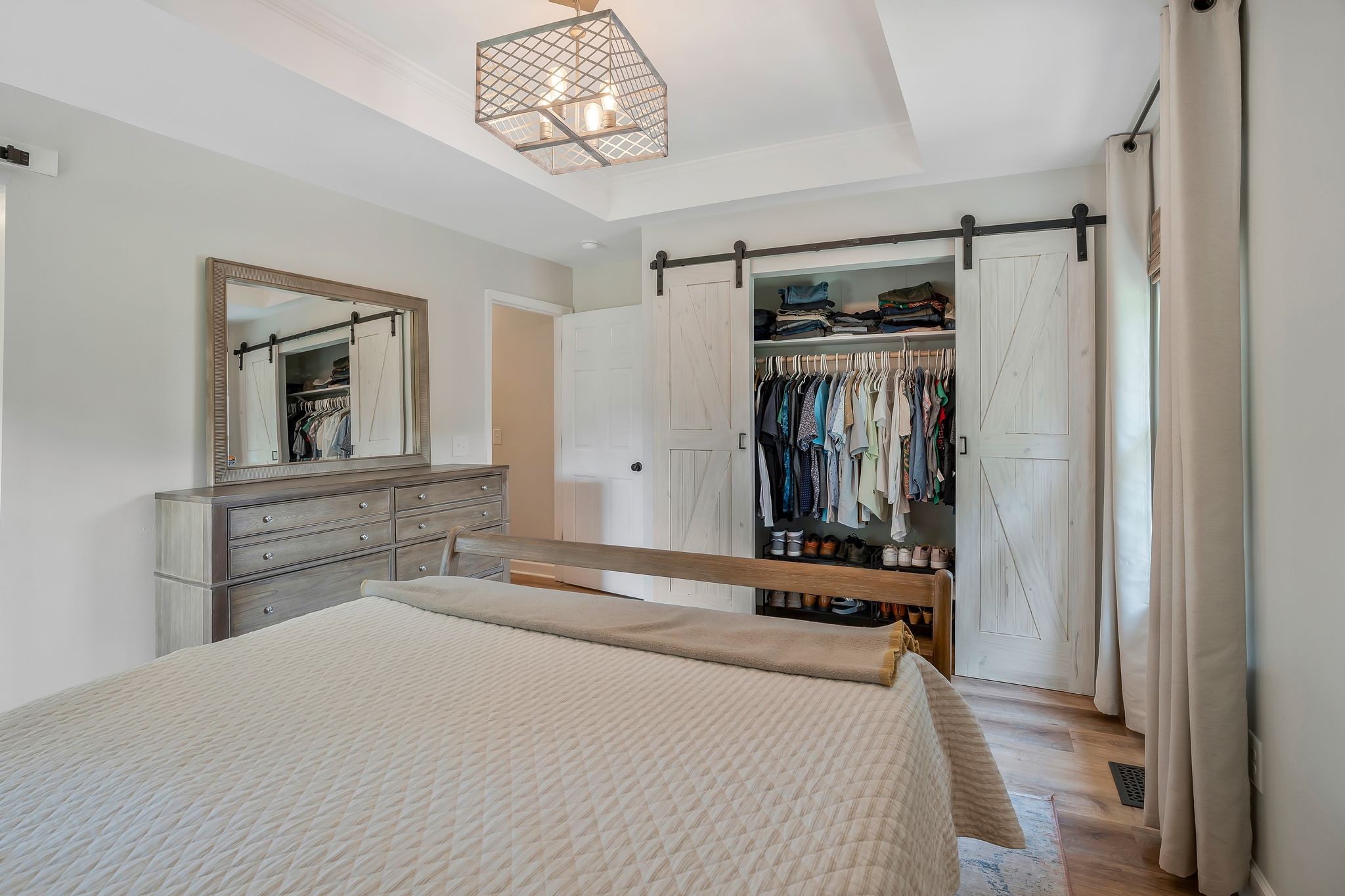2808 Windy Way Thompson's Station, TN 37179 - Photo 18 of 39 a bedroom with a bed and a chandelier