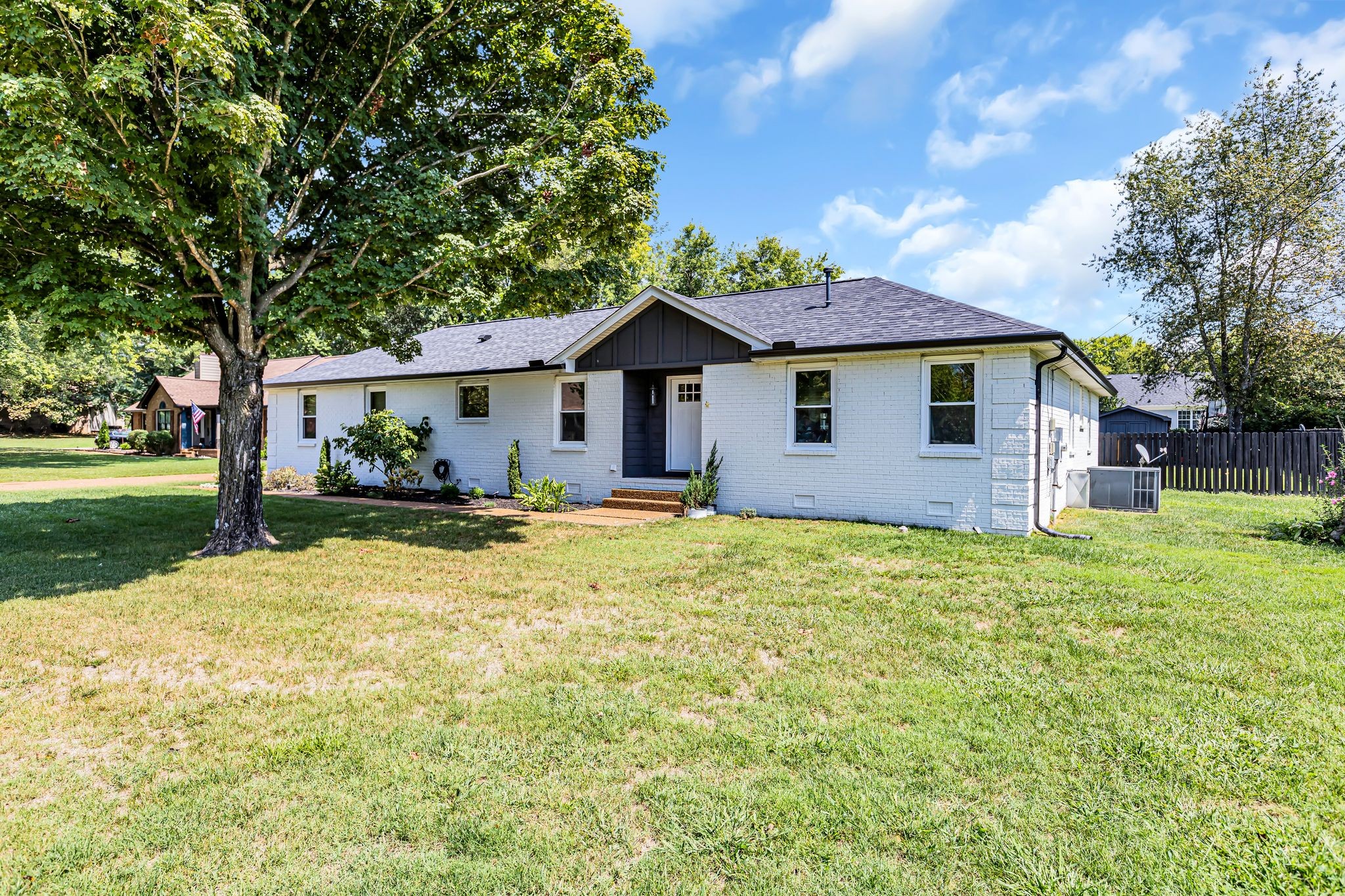 2808 Windy Way Thompson's Station, TN 37179 - Photo 2 of 39 a front view of a house with a garden