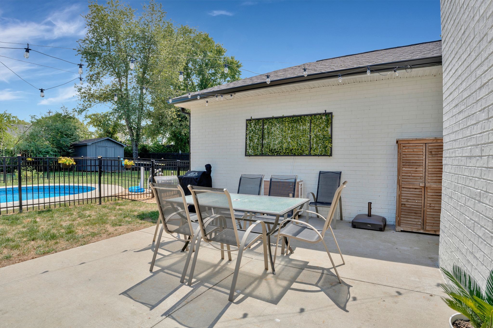 2808 Windy Way Thompson's Station, TN 37179 - Photo 26 of 39 a view of a backyard with table and chairs potted plants with wooden fence