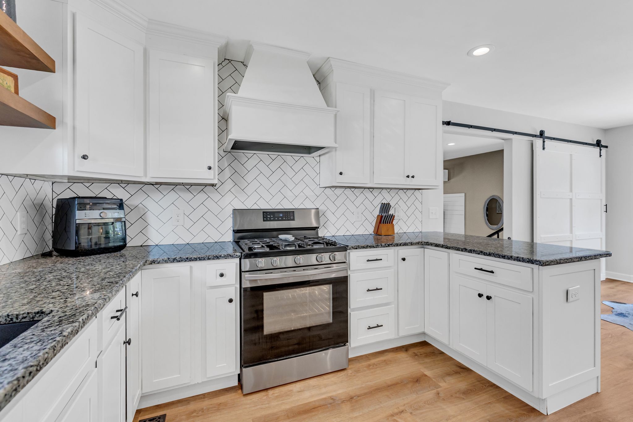 2808 Windy Way Thompson's Station, TN 37179 - Photo 10 of 39 a kitchen with granite countertop white cabinets and white stainless steel appliances