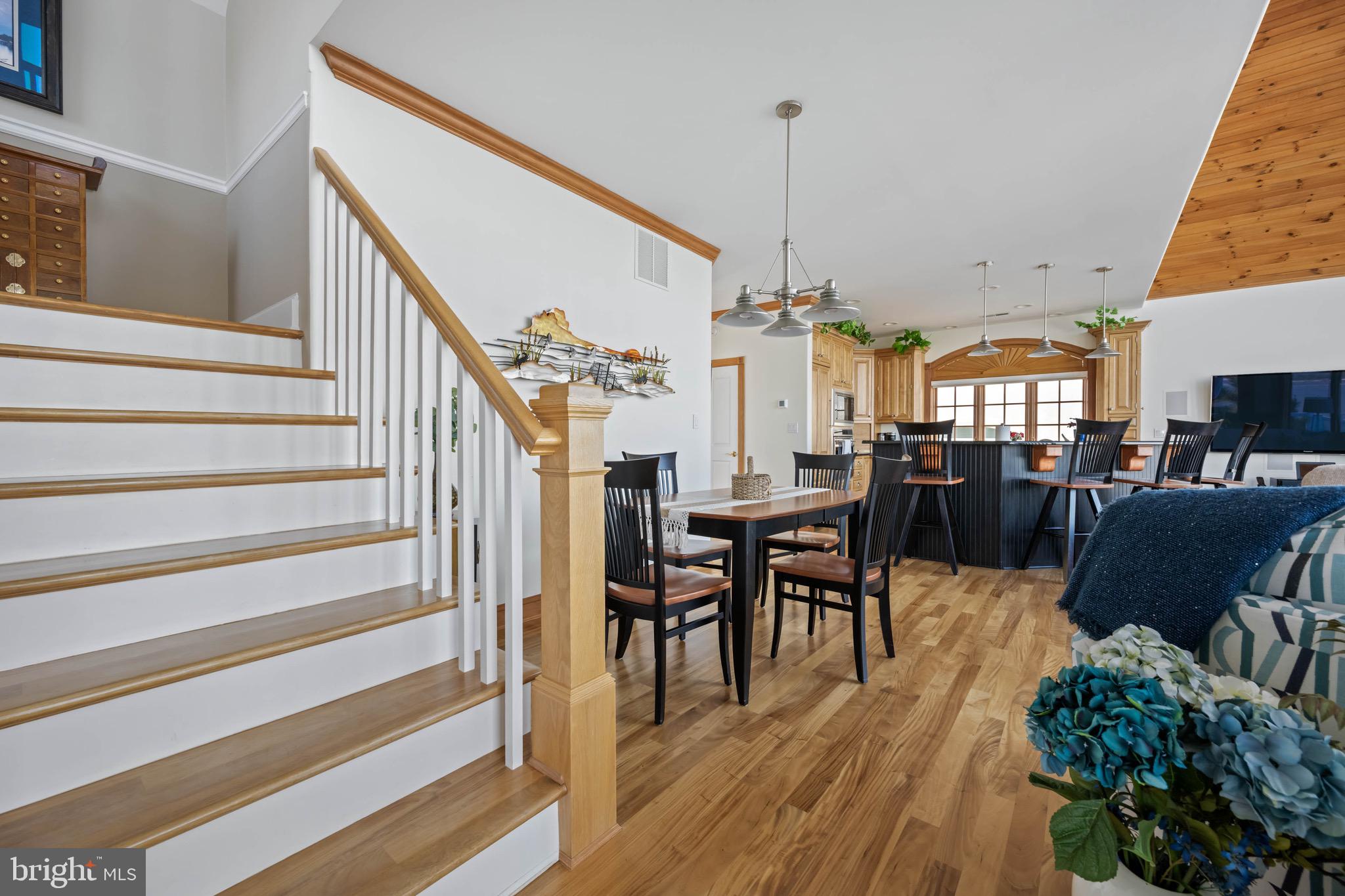 12959 Harbor Road Ocean City, MD 21842 - Photo 17 of 85 a view of a dining room with furniture and wooden floor