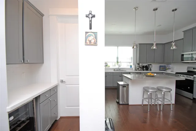 a kitchen with a sink cabinets and window