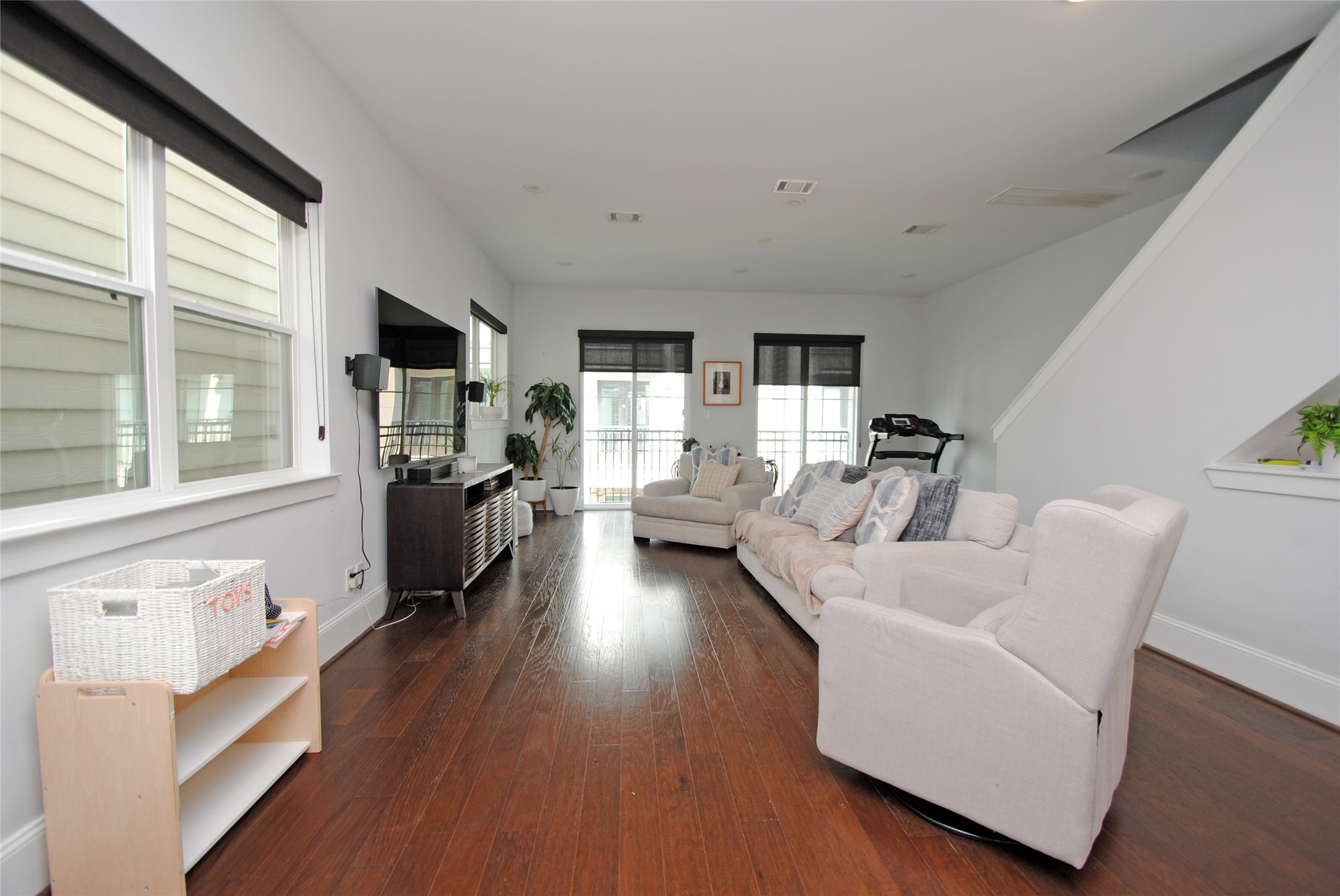 1262 North Post Oak Road, Unit B Houston, TX 77055 - Photo 17 of 44 a living room with furniture large window and wooden floor