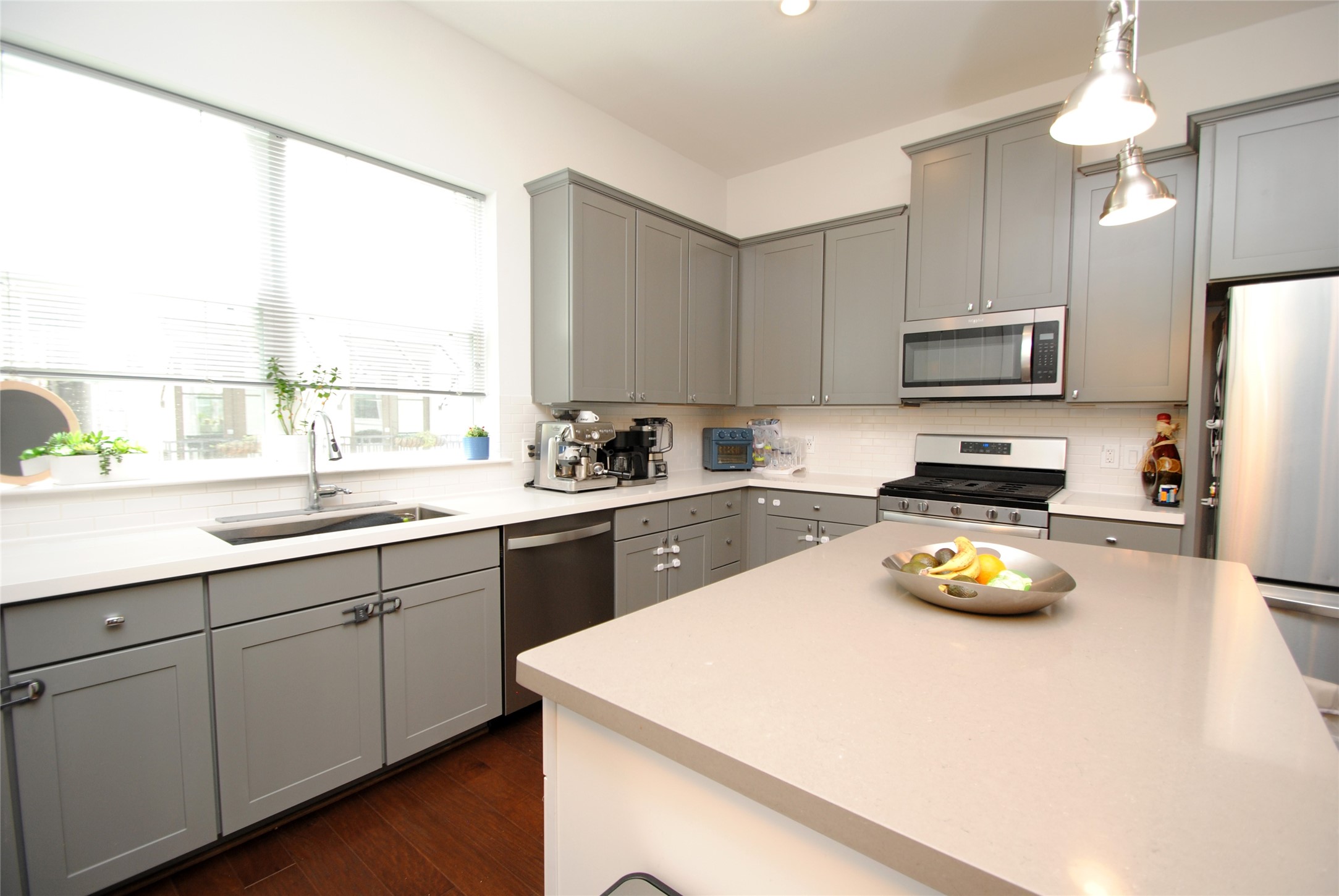 1262 North Post Oak Road, Unit B Houston, TX 77055 - Photo 19 of 44 a kitchen with a sink a counter top space cabinets and stainless steel appliances