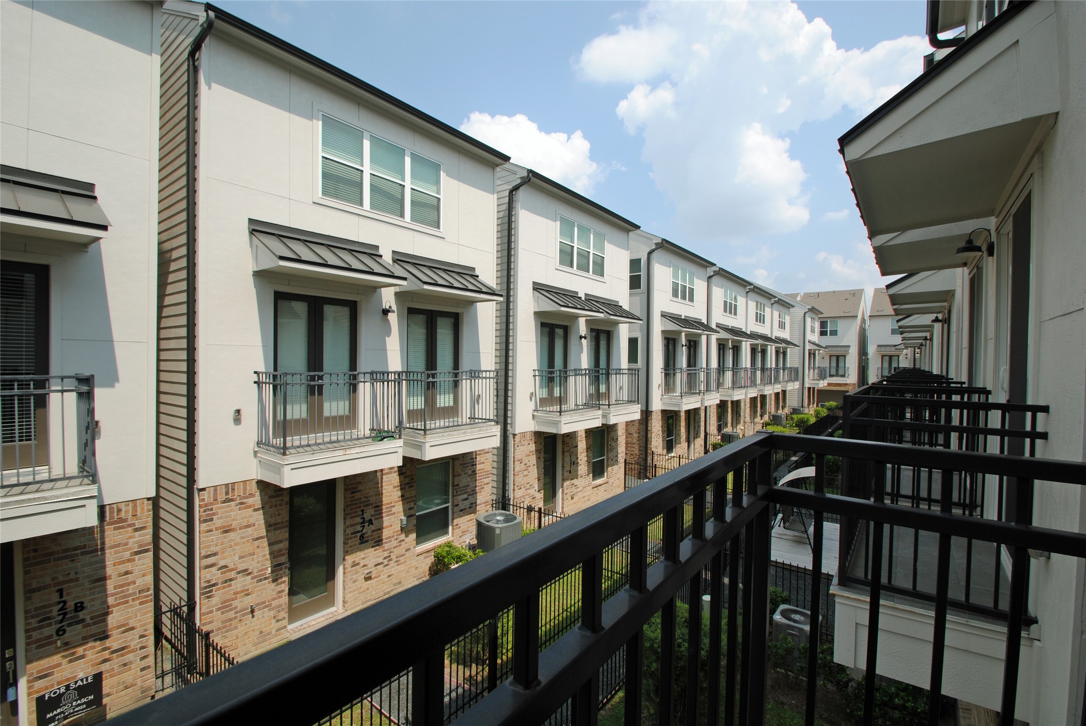 1262 North Post Oak Road, Unit B Houston, TX 77055 - Photo 25 of 44 a view of a large building with a window
