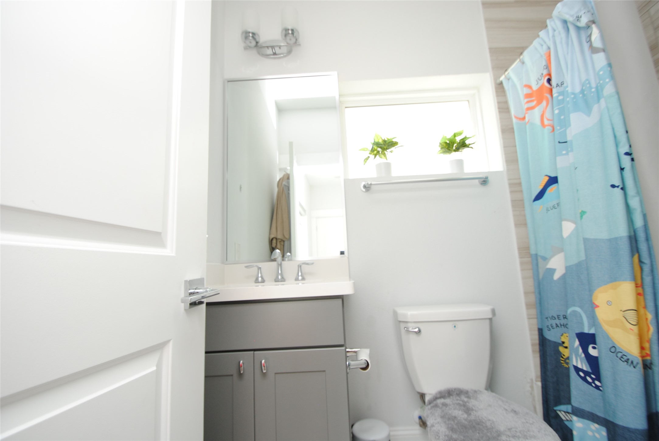1262 North Post Oak Road, Unit B Houston, TX 77055 - Photo 28 of 44 a bathroom with a sink mirror vanity and toilet