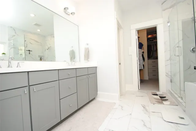 a bathroom with a sink and mirror