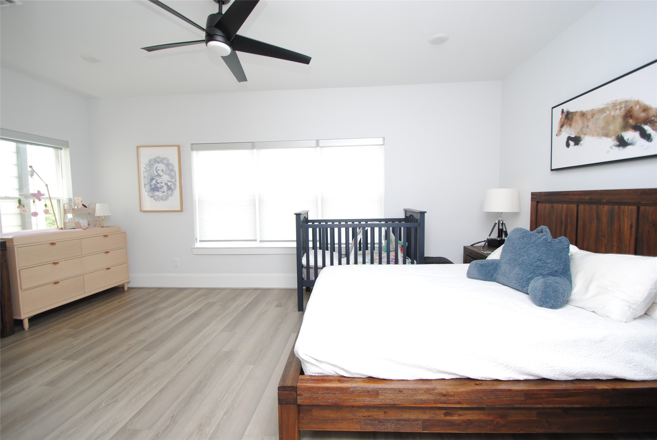 1262 North Post Oak Road, Unit B Houston, TX 77055 - Photo 39 of 44 a bedroom with a bed and wooden floor