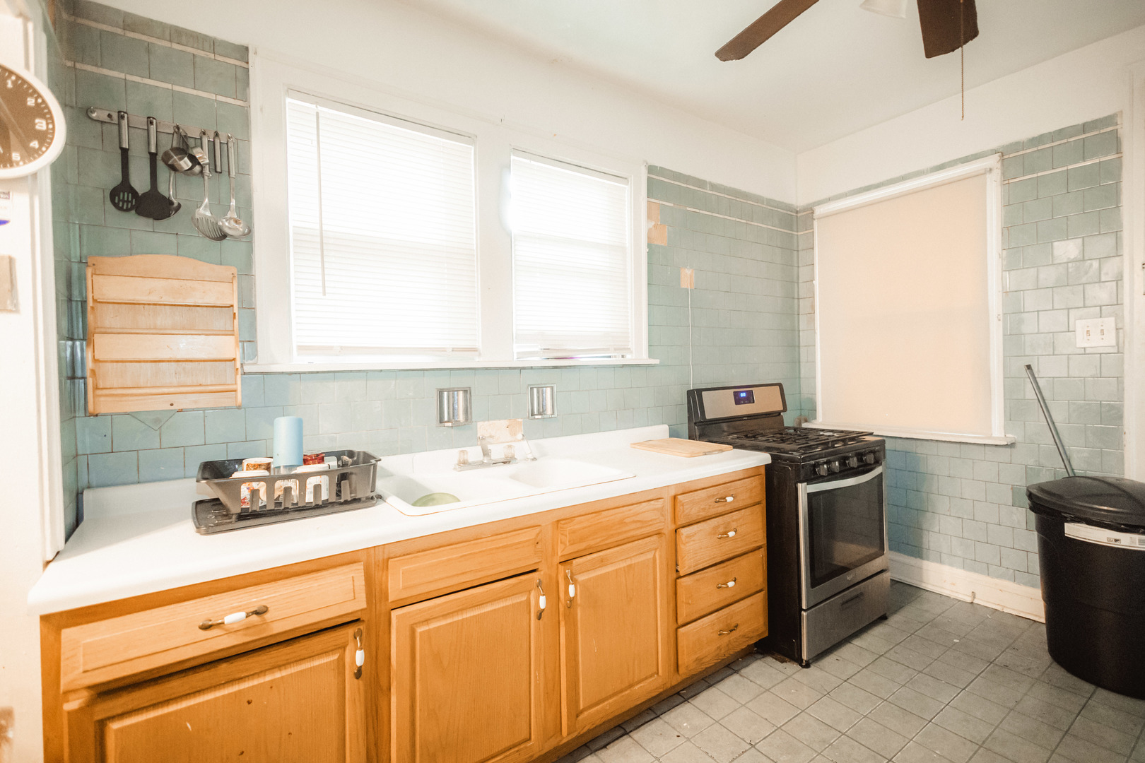1219 West 96th Street Chicago, IL 60643 - Photo 8 of 13 a kitchen with a sink stove and cabinets