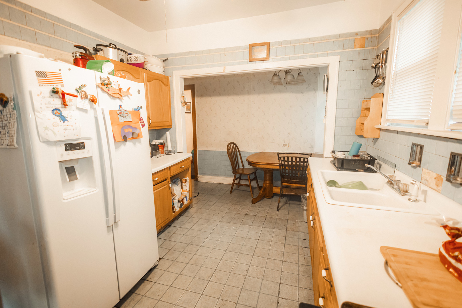 1219 West 96th Street Chicago, IL 60643 - Photo 9 of 13 a hallway with a white stove top oven a washer and dryer