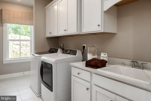 a view of washer and dryer with kitchen appliances