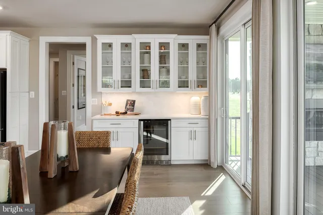 a kitchen with windows and refrigerator