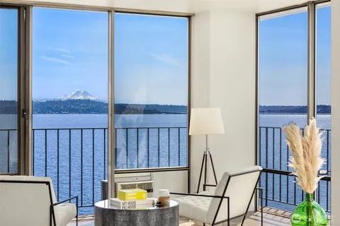 a view of a balcony with chair and wooden floor