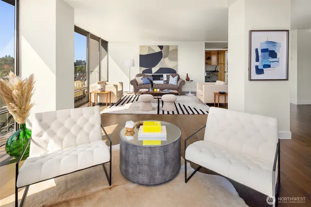 a living room with furniture and wooden floor