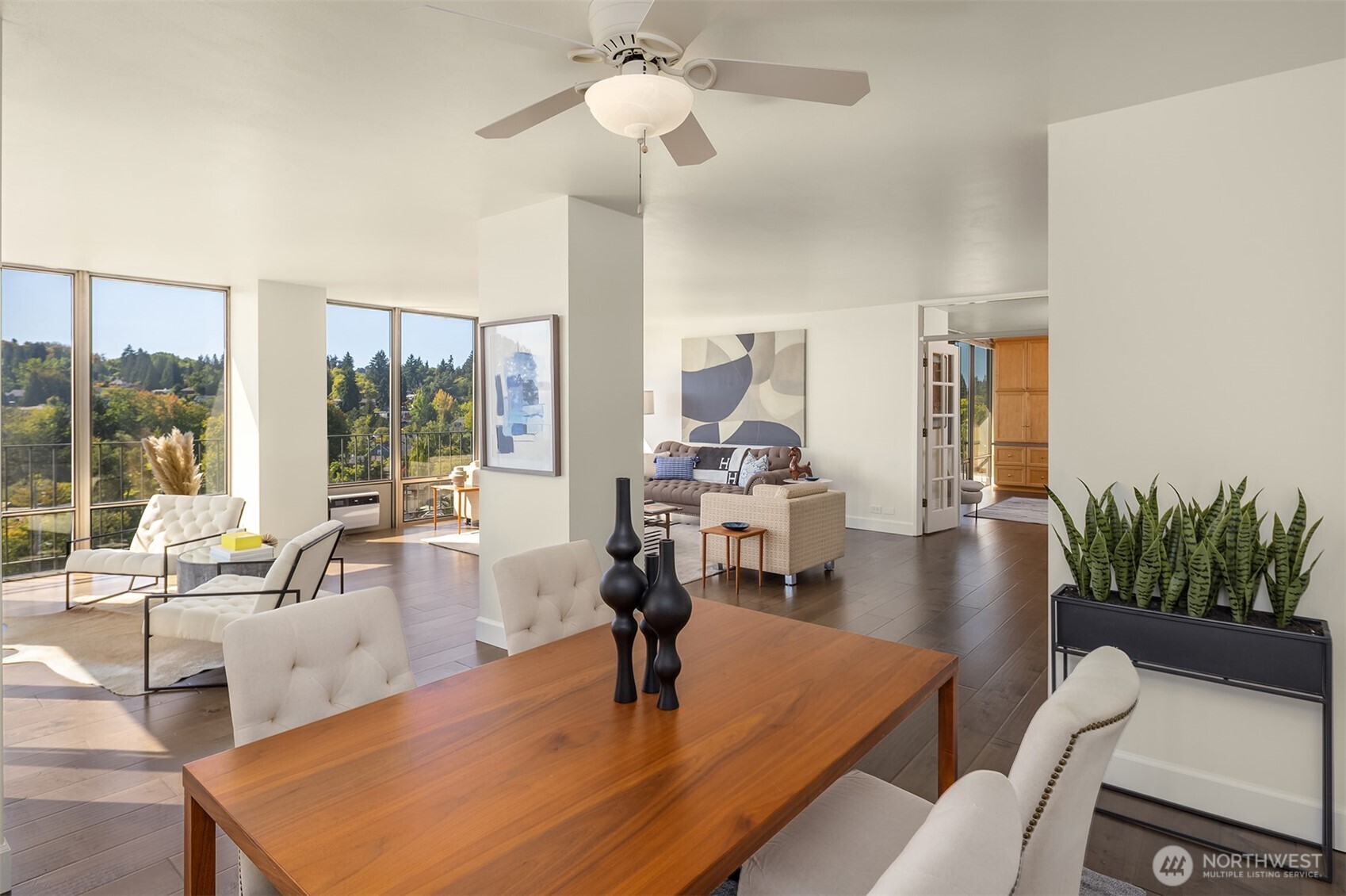 1620 43rd Avenue East, Unit 8C Seattle, WA 98112 - Photo 12 of 27 a living room with furniture and a floor to ceiling window