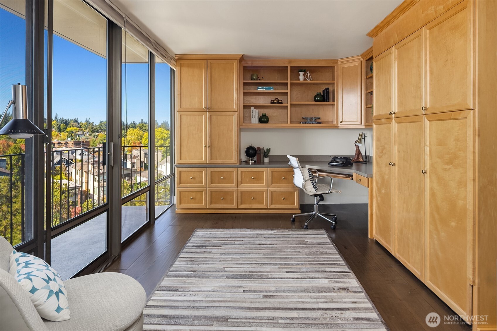 1620 43rd Avenue East, Unit 8C Seattle, WA 98112 - Photo 16 of 27 a view of a hallway with wooden floor and windows