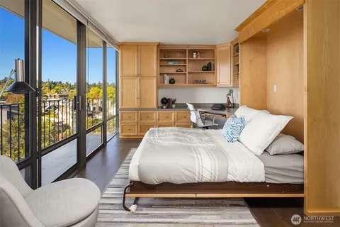 a bedroom with a large bed and a couch