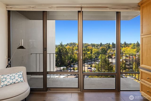 a view of an empty room and glass door