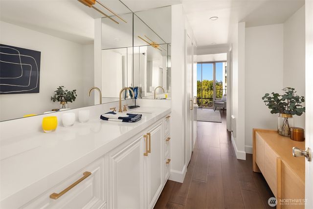 a kitchen with a sink appliances and cabinets