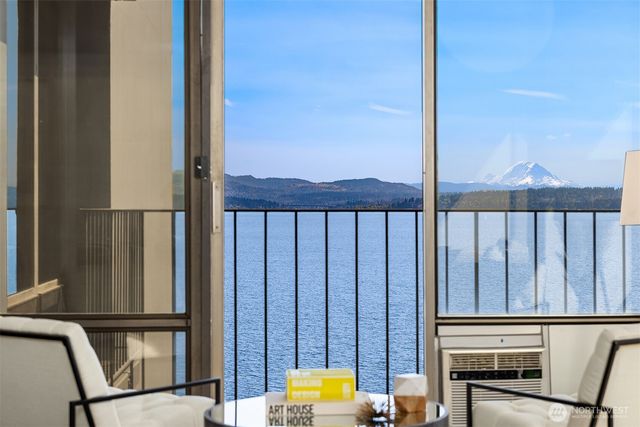 a view of a balcony with furniture