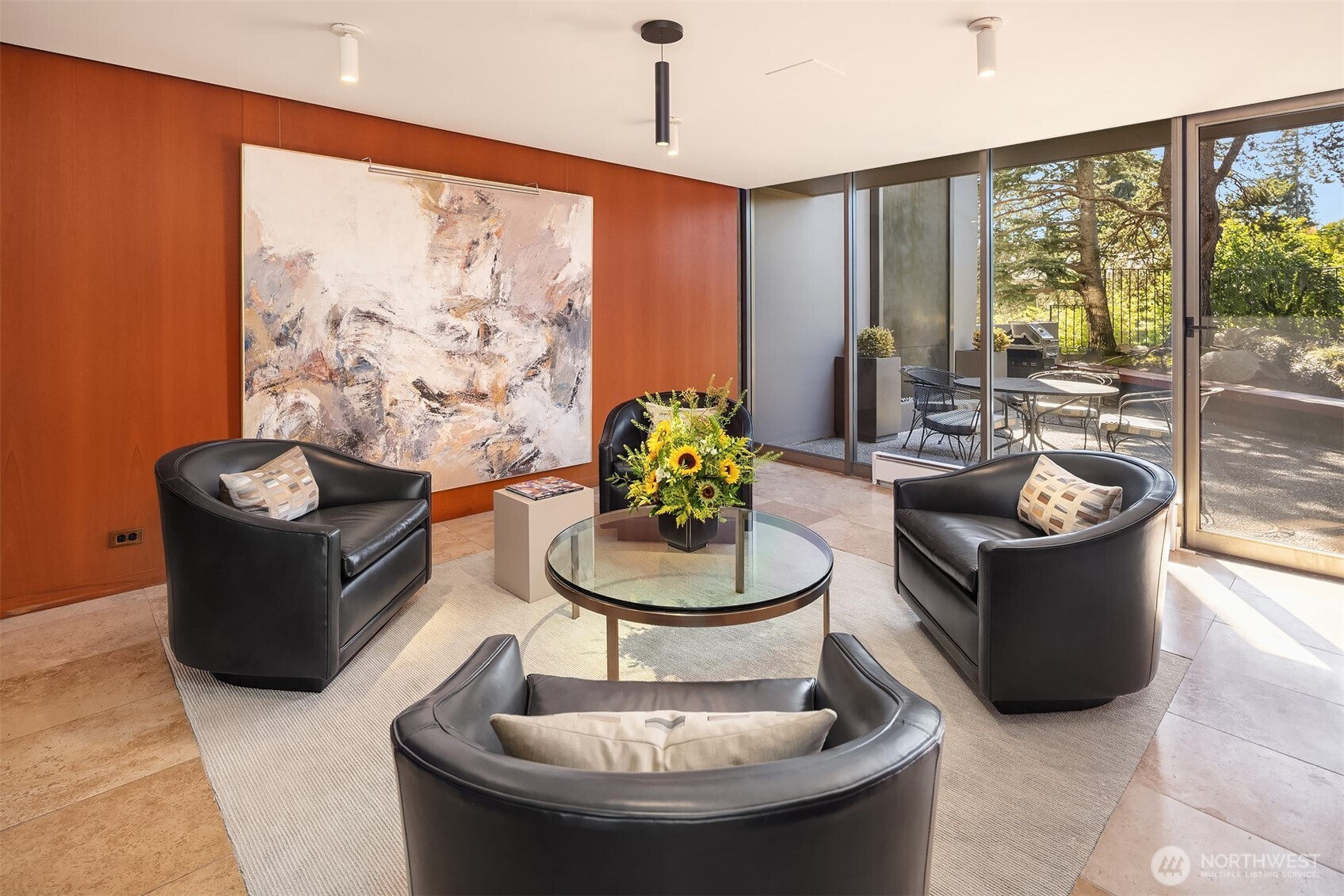 1620 43rd Avenue East, Unit 8C Seattle, WA 98112 - Photo 24 of 27 a living room with furniture and a potted plant