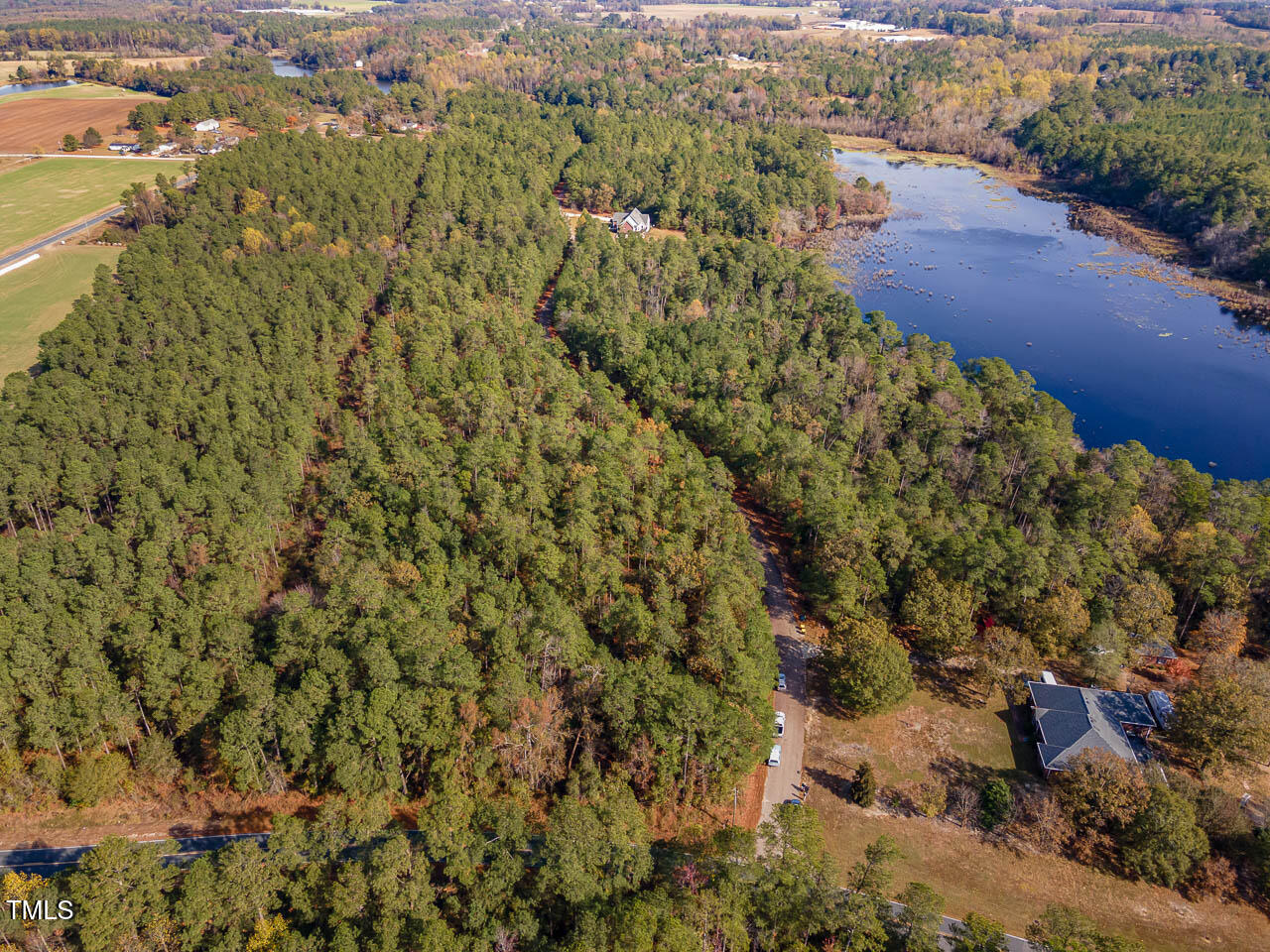an aerial view of house with yard and mountain view in back