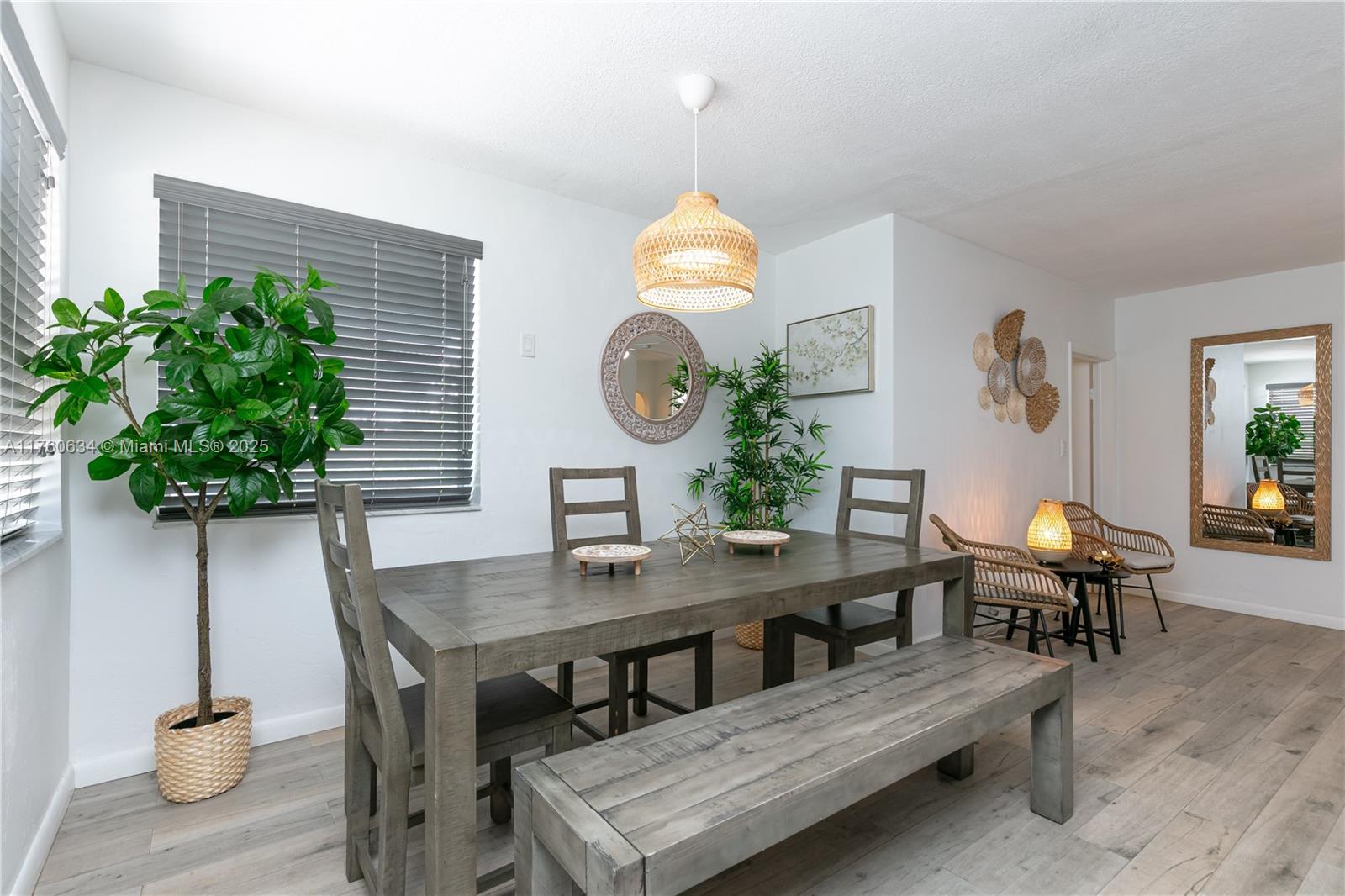 128 Southwest 5th Street Hallandale Beach, FL 33009 - Photo 4 of 17 a workspace with furniture and a potted plant
