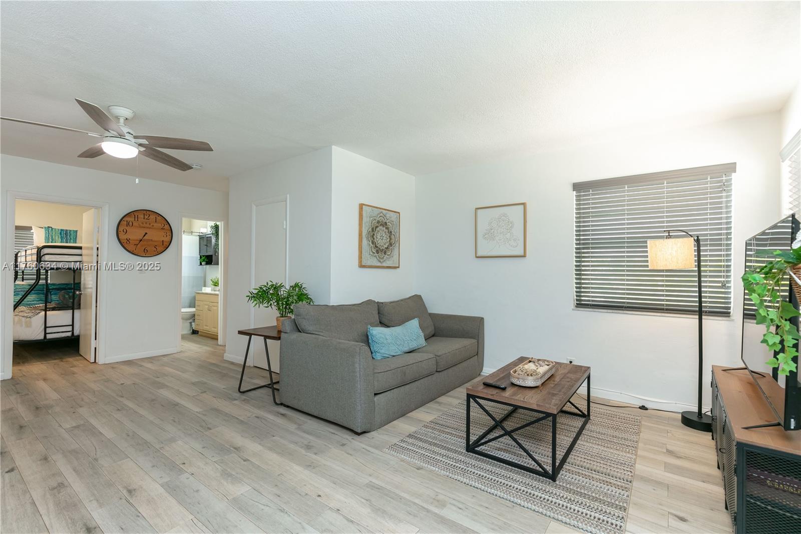 128 Southwest 5th Street Hallandale Beach, FL 33009 - Photo 5 of 17 a living room with furniture and a window