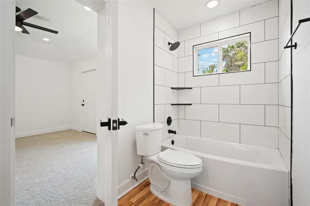 a bathroom with a toilet a sink and bathtub