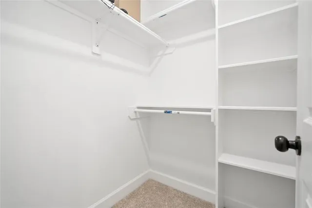 a view of an empty walk in closet