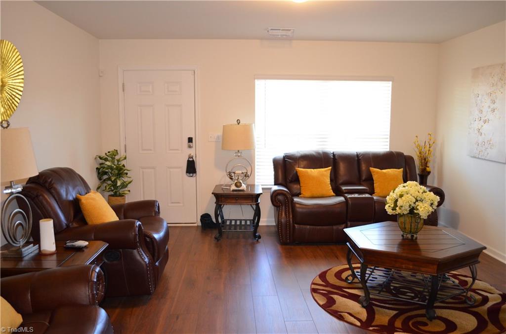 4688 Heatherly Road Winston-Salem, NC 27105 - Photo 2 of 17 Living room with vinyl plank