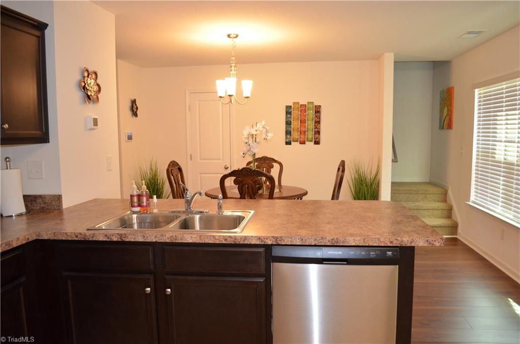 4688 Heatherly Road Winston-Salem, NC 27105 - Photo 6 of 17 Large island in kitchen opens to dining room.