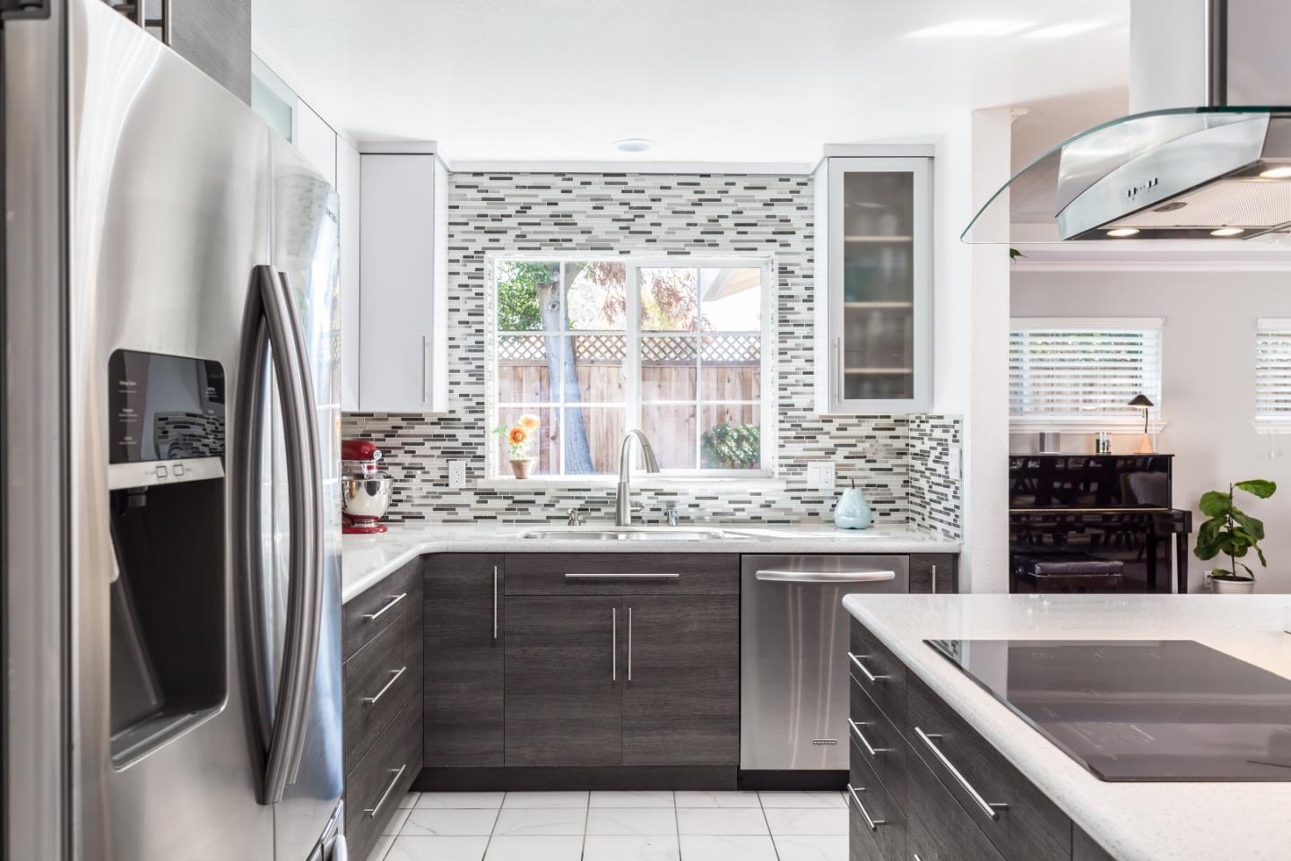 1920 Playa Street San Mateo, CA 94403 - Photo 17 of 43 a kitchen with stainless steel appliances granite countertop a refrigerator and a sink