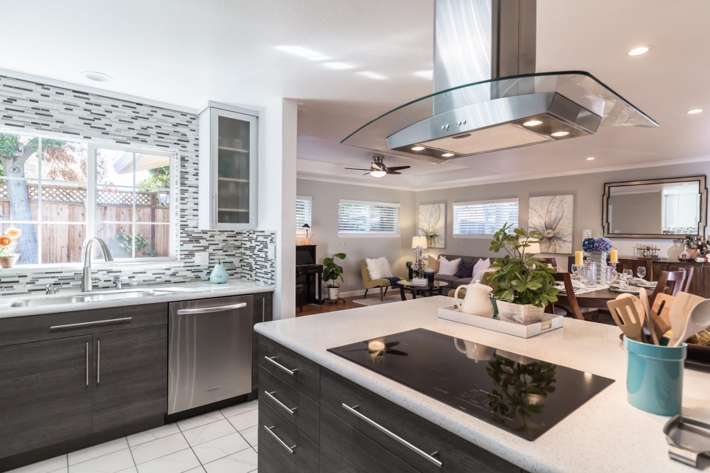 1920 Playa Street San Mateo, CA 94403 - Photo 19 of 43 a view of a kitchen center island cabinets and living room view