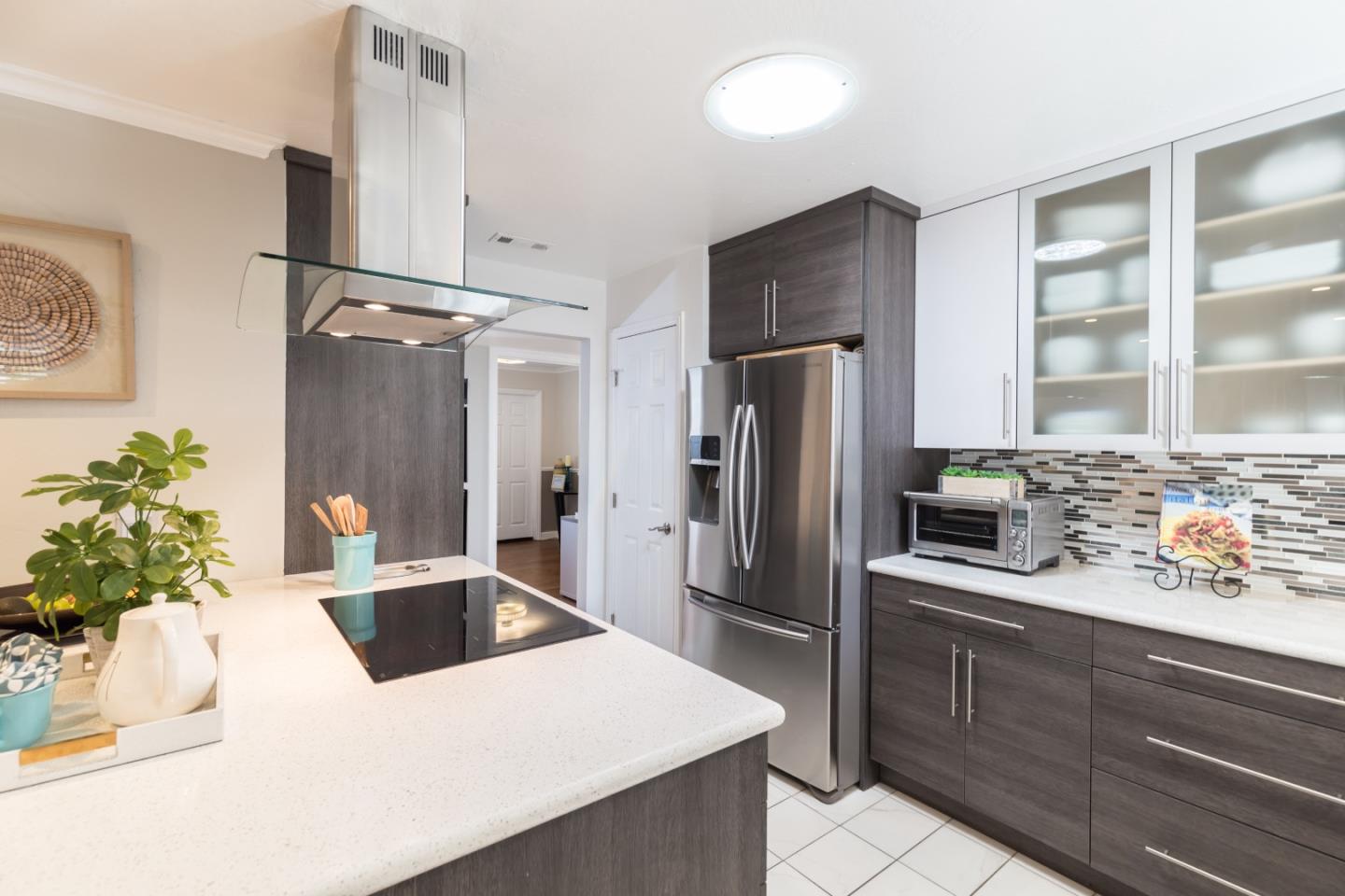 1920 Playa Street San Mateo, CA 94403 - Photo 20 of 43 a kitchen with stainless steel appliances a refrigerator sink and cabinets