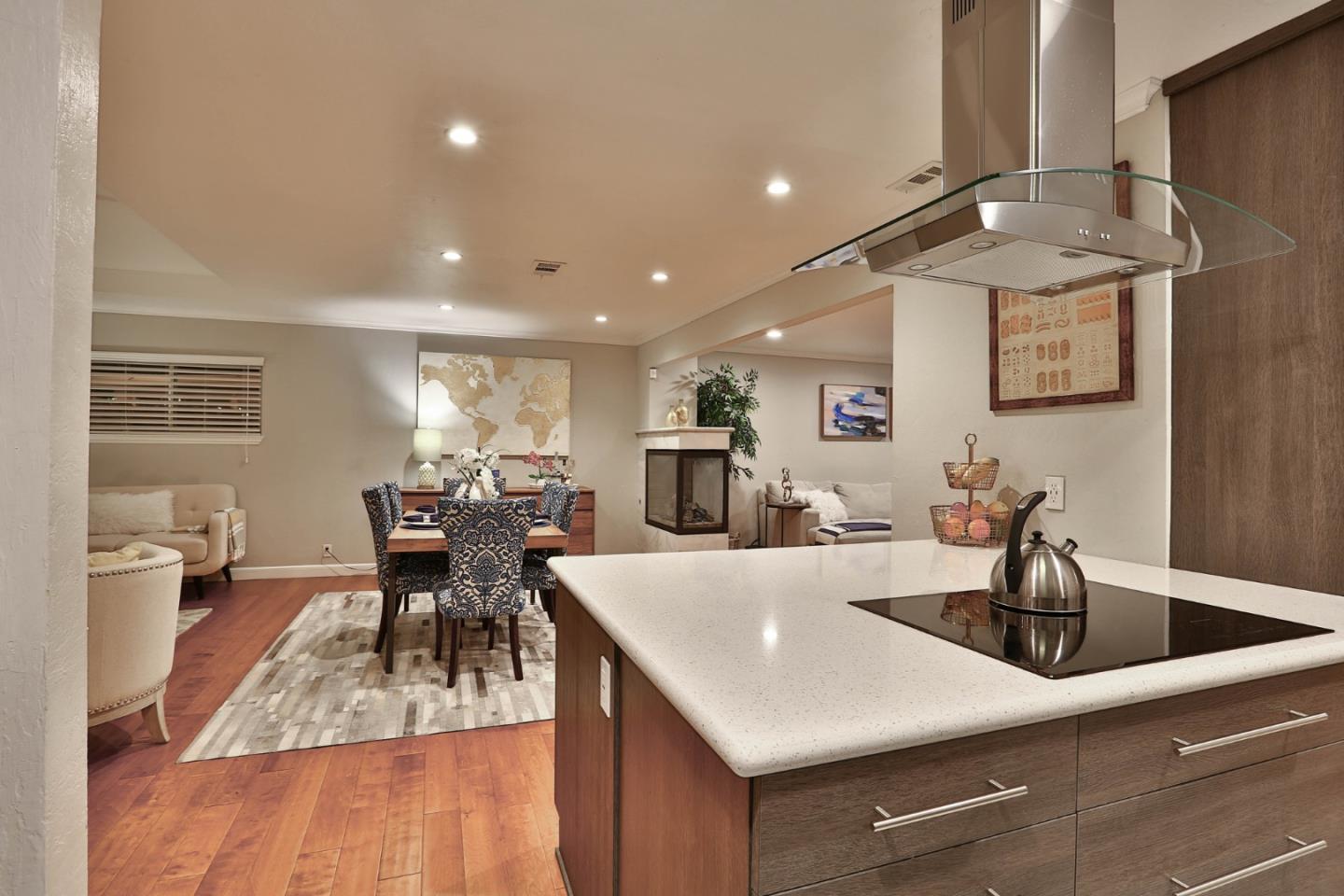 1920 Playa Street San Mateo, CA 94403 - Photo 23 of 43 a kitchen with center island table and chairs
