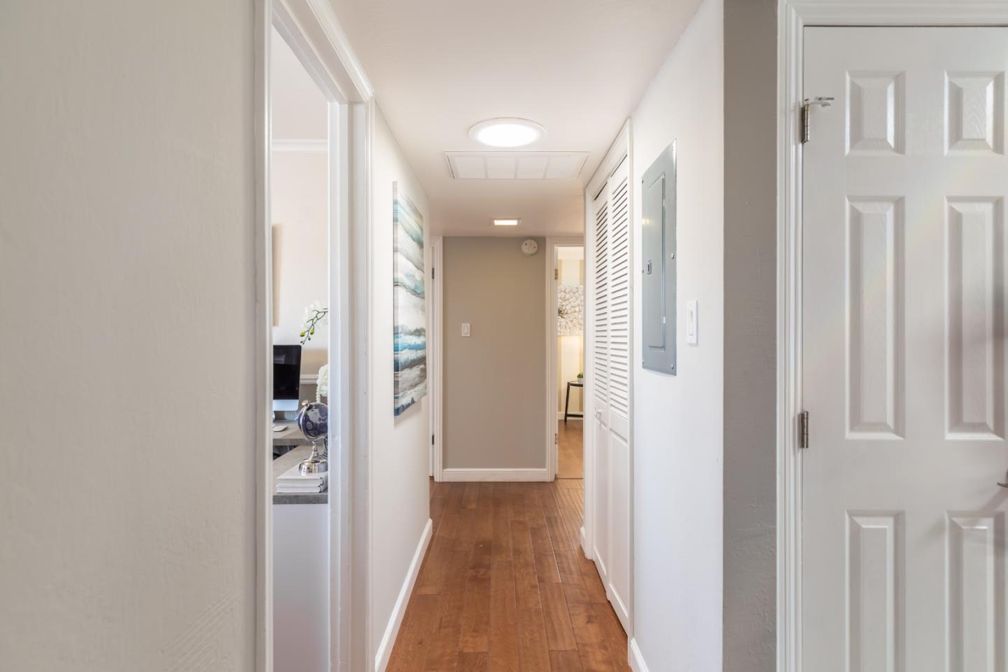 1920 Playa Street San Mateo, CA 94403 - Photo 24 of 43 a view of a hallway with wooden floor and closet