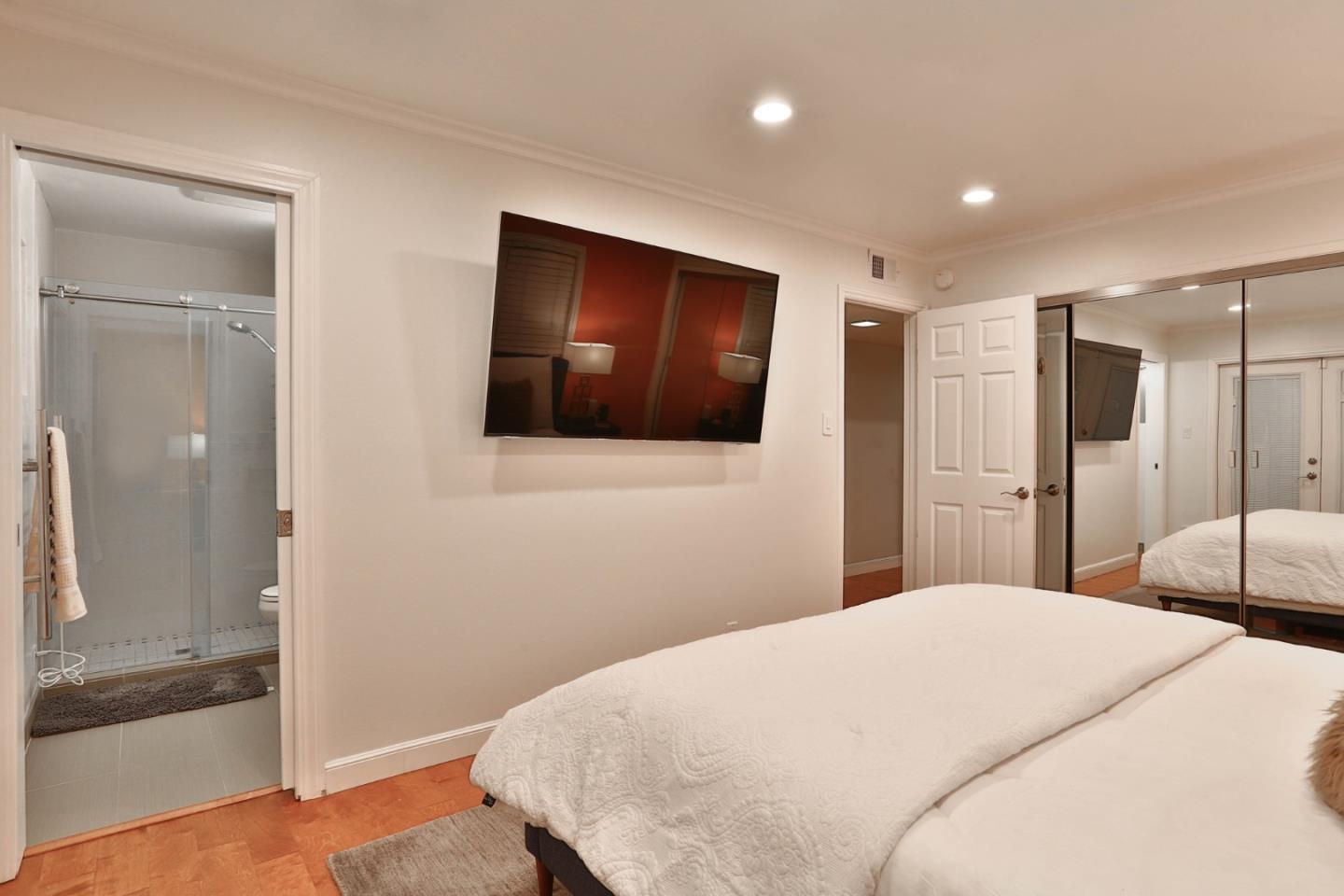 1920 Playa Street San Mateo, CA 94403 - Photo 26 of 43 a bedroom with a bed and a flat screen tv