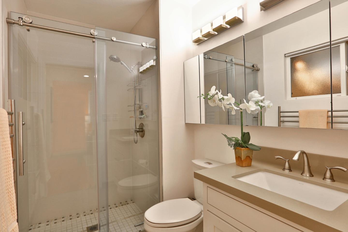 1920 Playa Street San Mateo, CA 94403 - Photo 27 of 43 a bathroom with a granite countertop sink toilet and shower