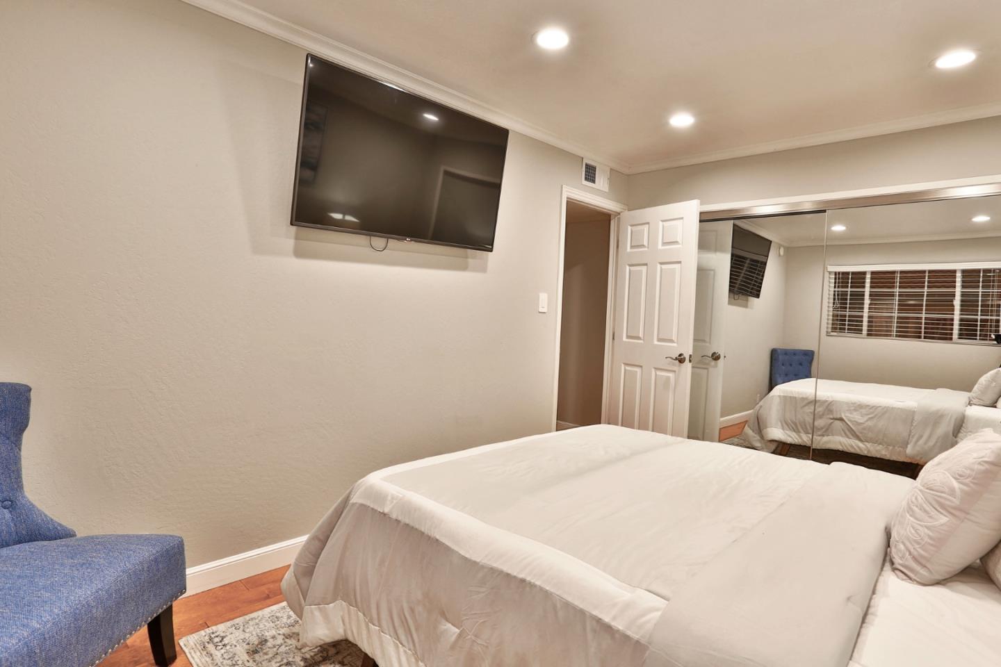 1920 Playa Street San Mateo, CA 94403 - Photo 29 of 43 a bedroom with a bed and a flat screen tv
