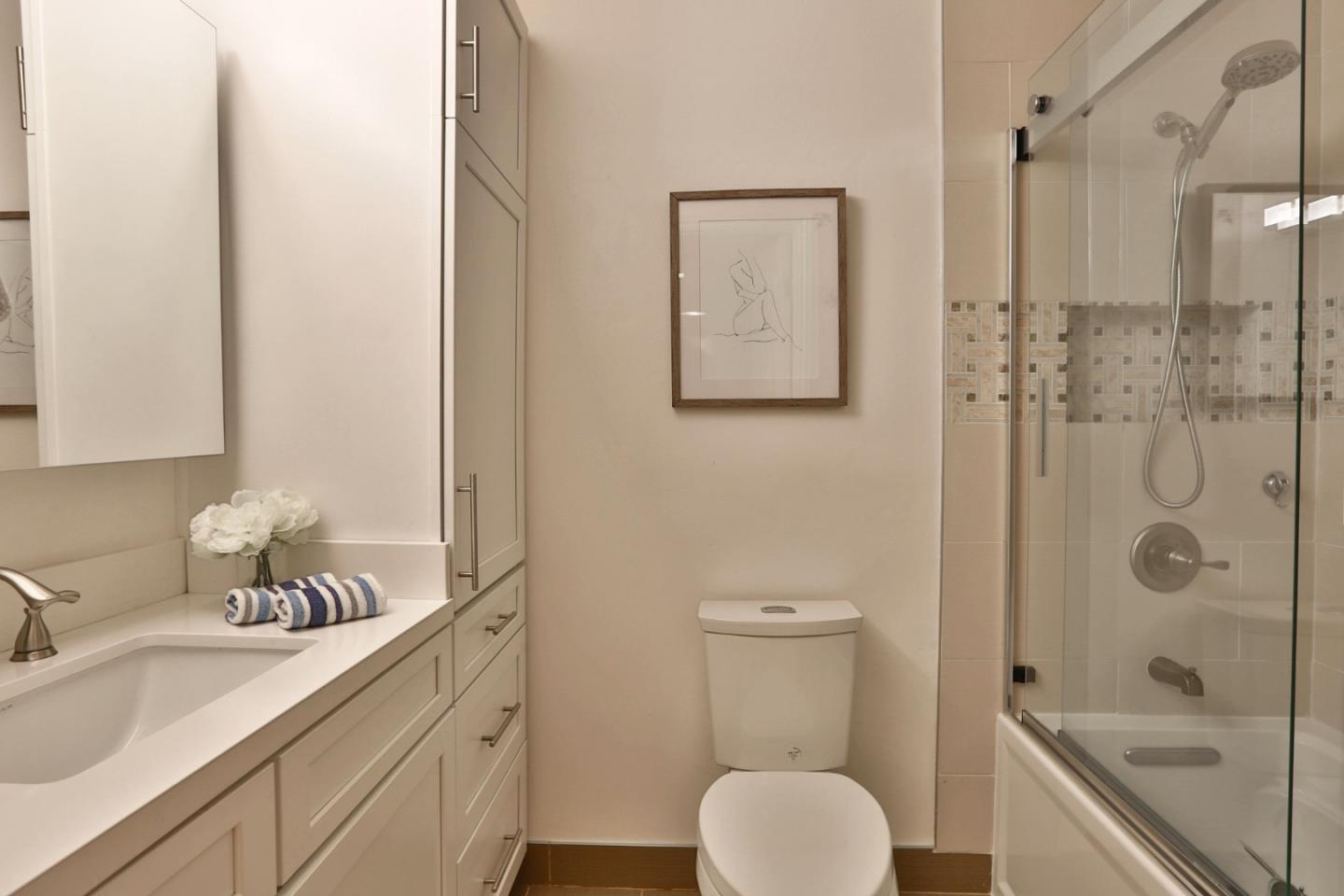 1920 Playa Street San Mateo, CA 94403 - Photo 32 of 43 a bathroom with a granite countertop sink toilet and shower