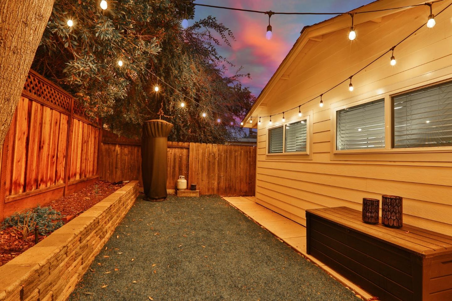 1920 Playa Street San Mateo, CA 94403 - Photo 39 of 43 a view of a backyard with wooden fence and large trees