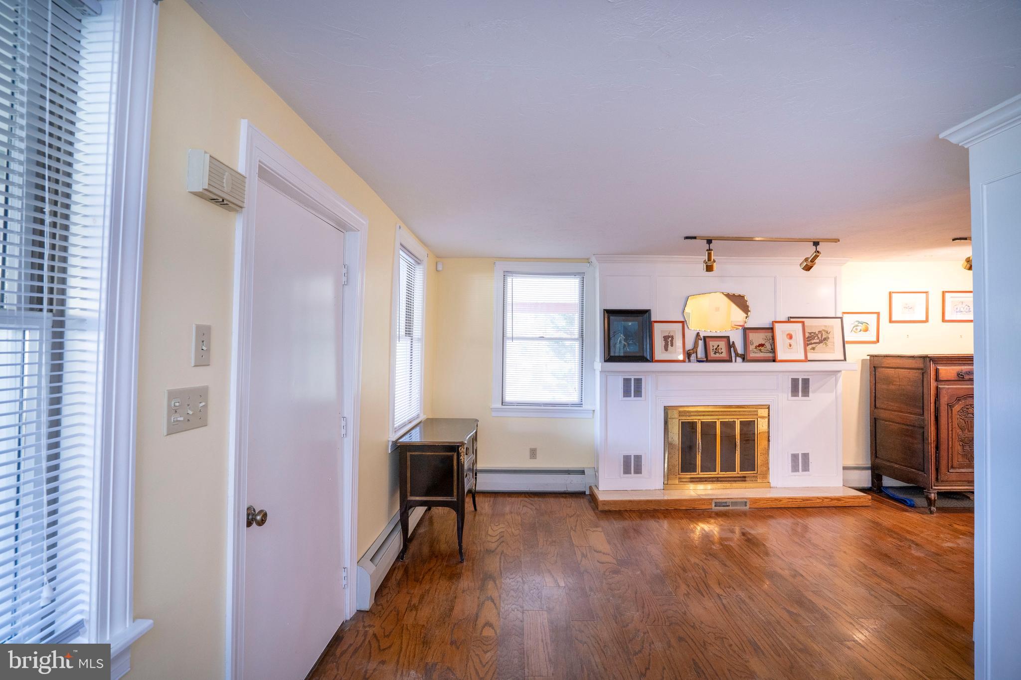 9980 Douglas Road Red Lion, PA 17356 - Photo 14 of 64 a view of a livingroom with a fireplace and workspace