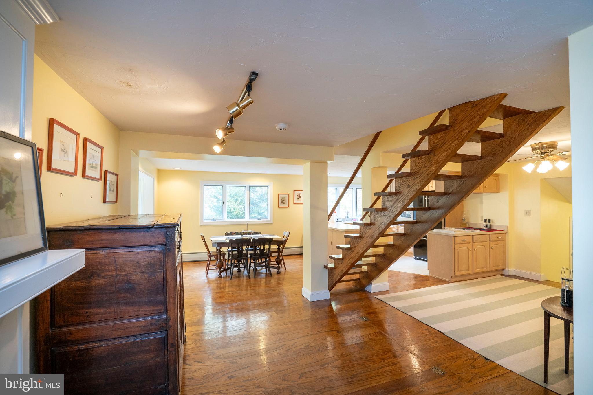 9980 Douglas Road Red Lion, PA 17356 - Photo 18 of 64 a view of entryway livingroom and hall with wooden floor