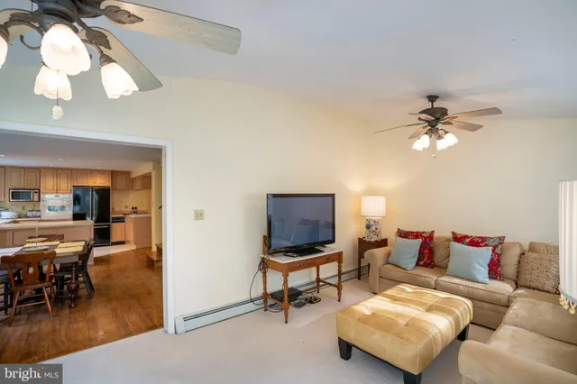 a bathroom with a toilet a sink and a mirror