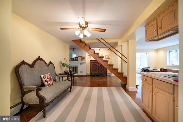 a view of a roof deck with table and chairs and potted plants