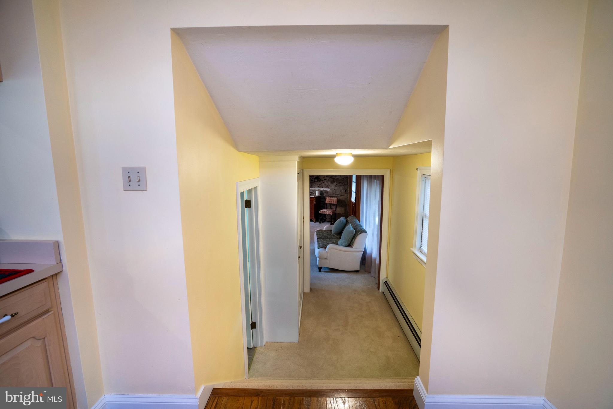 9980 Douglas Road Red Lion, PA 17356 - Photo 30 of 64 a view of a hallway with wooden floor and living room