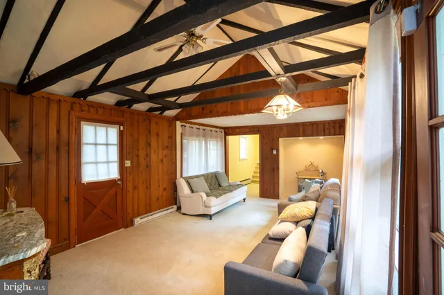 a bathroom with a mirror a sink and shower